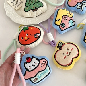 Detailed embroidery on colorful plush cartoon keychains with woven macaron lanyards