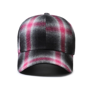 Pink and black plaid baseball cap featuring a classic curved brim and six-panel design