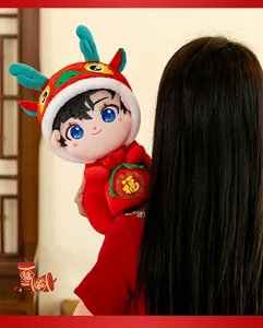 Detail view of 2024 Year of the Dragon plush doll with red dragon hat and lucky Fu bag