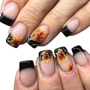 French tip press-on nails with autumn black edges and orange maple leaf designs