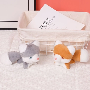 Detail of cute grey and orange husky plush keychains with soft faux fur texture