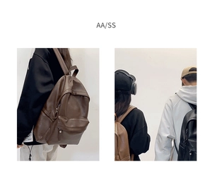 Front view of minimalist brown and black leather backpacks with soft texture