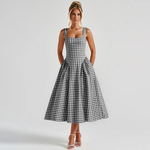 Detail of checkered print dress with side pockets and elegant square neckline style