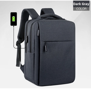Detail of dark grey business backpack showing the integrated external USB charging port