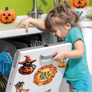Halloween gnome skull magnets applied on dishwasher with trick or treat pumpkin theme
