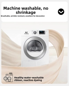 Detail of washable beige chair cover fabric swirling around a washing machine drum