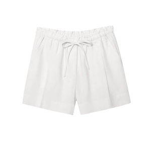 Detailed view of white linen blend shorts featuring elastic drawstring waist and side pockets