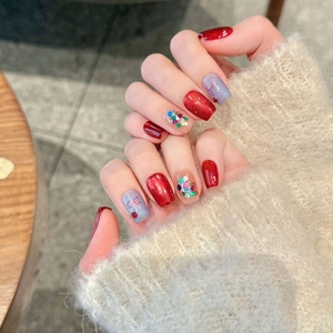Ruby cat eye press-on nails with red bows, silver glitter and luxury crystal accents