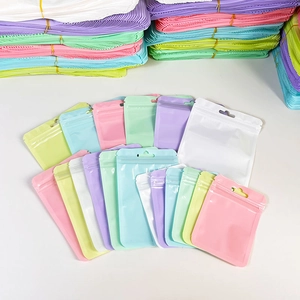 Macaron colored resealable plastic bags with round hanging holes and zip lock closure