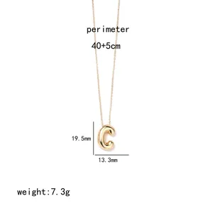 Detail of gold letter C pendant with dimensions 19.5mm by 13.3mm on stainless steel chain