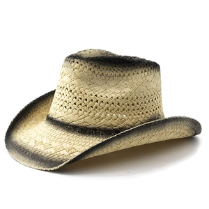 Classic straw cowboy hat with black gradient spray paint and upturned brim for summer sun