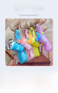 Detail view of colorful milk tea cup keychains with donut charms in four vibrant colors