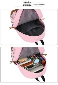 Detail view of pink backpack interior showing spacious compartments for laptop and gear
