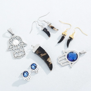 Hamsa Hand and horn pendant jewelry set with blue crystal in gold and silver finish