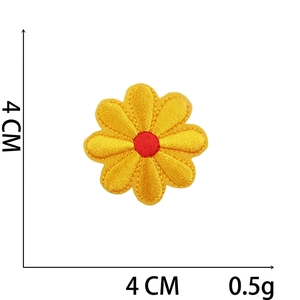 Detail of yellow flower embroidery patch with red center and dimensions of 4cm by 4cm