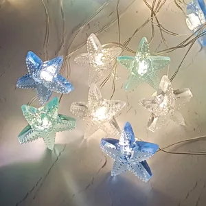 Close-up of LED starfish string lights in blue and green with realistic textured finish
