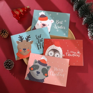 Set of Christmas cards with cartoon winter animals on festive red background