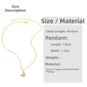 Detailed view of butterfly pendant necklace in gold-plated brass with cubic zirconia stones