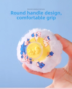 Detail of round baby powder puff with soft long fur, easy-grip handle and cartoon dust cover