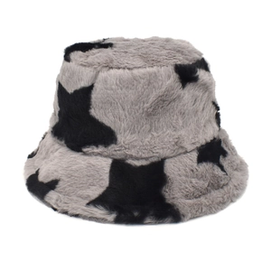 Detail of plush faux rabbit fur bucket hat with black star print on grey texture