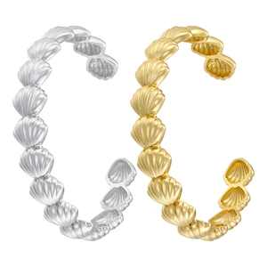 Ocean style seashell open adjustable ring set in polished gold and silver finishes