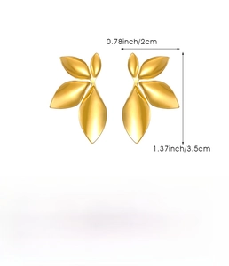 Macro view of gold leaf stud earrings in stainless steel with detailed dimensions