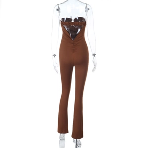 Detailed back view of brown backless jumpsuit showing cut-out design and flared leg cut