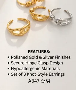 Detail of twisted metal rings in gold and silver finish set on minimalist paper