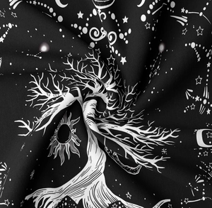 Detailed macro view of black and white Tree of Life tapestry with sun and moon patterns