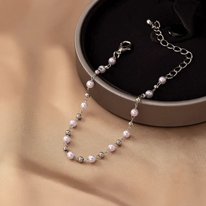 Detail of light purple pearl and silver bead bracelet with adjustable lobster clasp