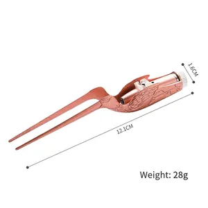 Red bronze bird-shaped ear cleaner tool with LED light and carved metal relief patterns