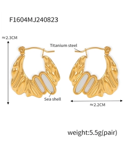 Detailed view of 18k gold irregular earrings with shell inlay and measurement specs