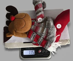 Detailed view of a Christmas reindeer plush curtain buckle weighing 115 oz on a digital scale