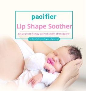 Close-up of baby wearing funny pink lip-shaped silicone pacifier in a warm lifestyle scene