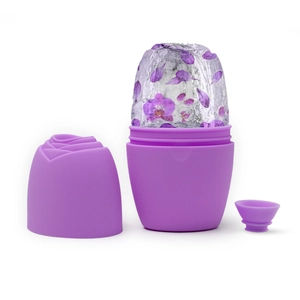 Detail view of purple silicone ice roller with rose cap, funnel and frozen petals inside