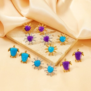 Detailed set of ocean-themed earrings featuring purple hearts and blue sea turtle designs
