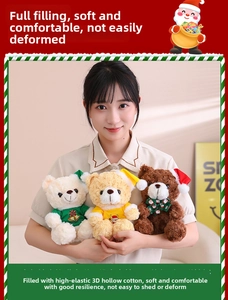 Close-up of three plush Christmas teddy bears with holiday hats and soft hollow cotton fill