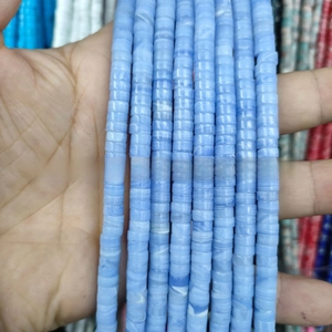 Close-up of blue marble pattern disc spacer beads for DIY jewelry making accessories