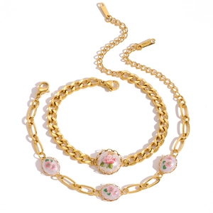 Vintage gold stainless steel jewelry set with floral charms and elegant cuban links