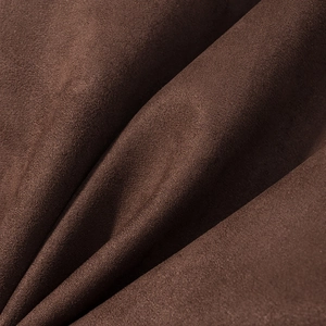 Detailed macro view showing the soft texture of dark brown suede fabric on the jacket