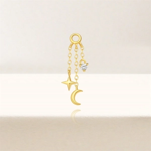 Detail of gold starry moon jewelry charm with star and crescent zircon pendants