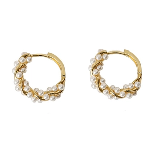 Elegant gold twisted hoop earrings with small white pearls on a minimalist white background