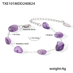 Detail of bohemian purple natural stone bracelet with stainless steel chain and logo tag