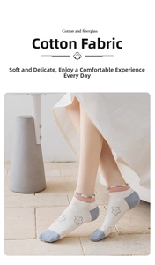 Detail of cotton crew socks with blue star patterns and pink wavy cuffs for women
