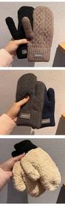 Close-up of knit winter gloves with soft fleece lining and classic leather patch detail