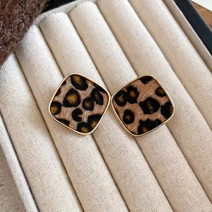 Square leopard print geometric studs with golden frames and vintage velvet finish
