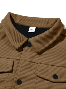 Detail of corduroy texture, front buttons, and size L label on brown long sleeve shirt