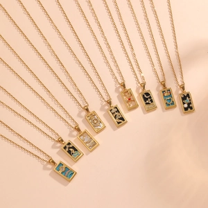 Set of ten gold titanium steel tarot necklaces with rectangular enamel pendants