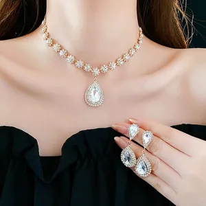 Elegant gold finish necklace and earring set with water drop shaped sparkling zircons