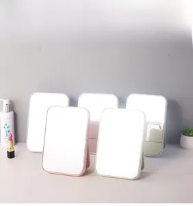 Collection of portable folding desktop makeup mirrors in various pastel colors